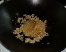 Shallots, garlic and sambal frying in the wok