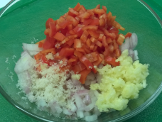 Prepared shallots, garlic, chili peppers and laos in a bowl